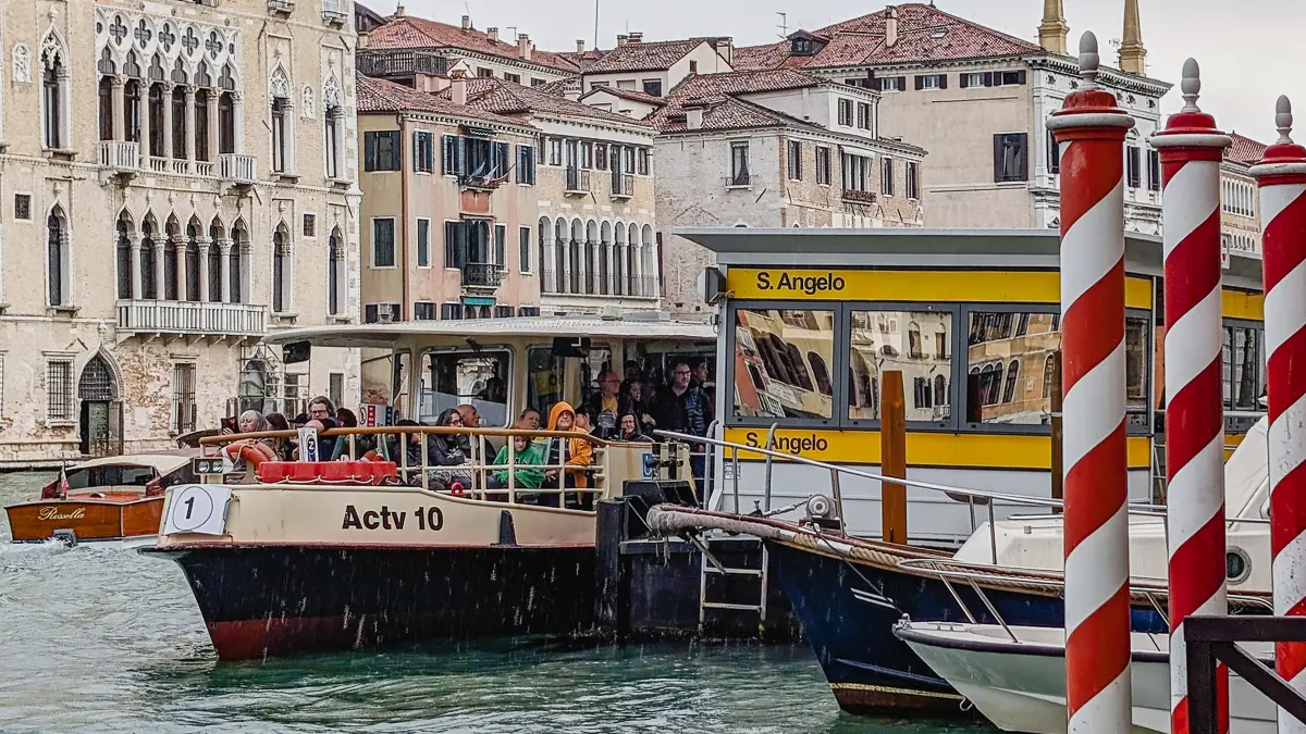 ACTV water bus approaches the Sant'Angelo vaporetto stop on the Grand Canal. Grand Canal.