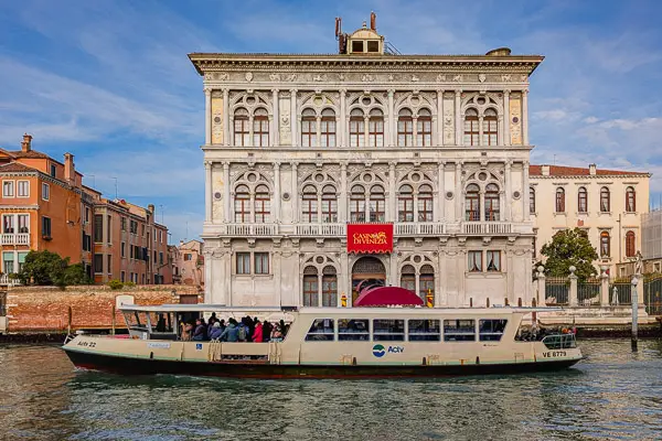 An ACTV No. 1 vaporetto passes the Casino di Venezia near the San Marcuola waterbus stop.