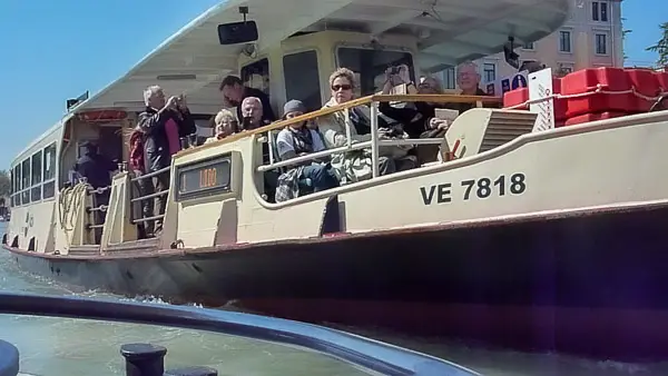 ACTV No. 1 vaporetto passes another water bus on the Grand Canal.